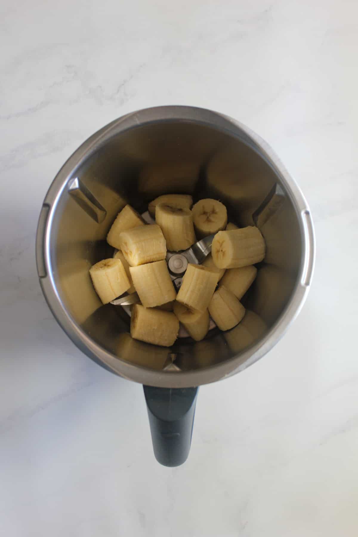 Frozen banana pieces in a Thermomix bowl