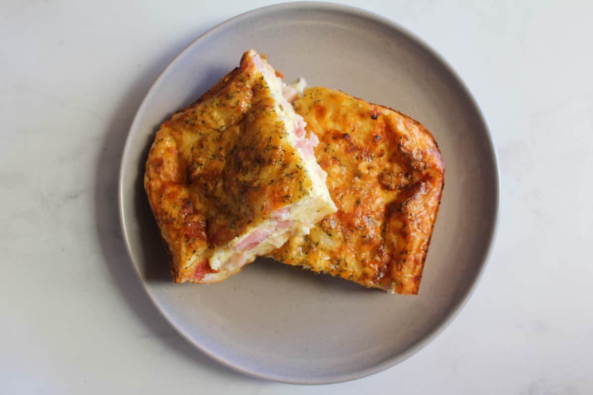 Egg and Bacon pie on grey plate