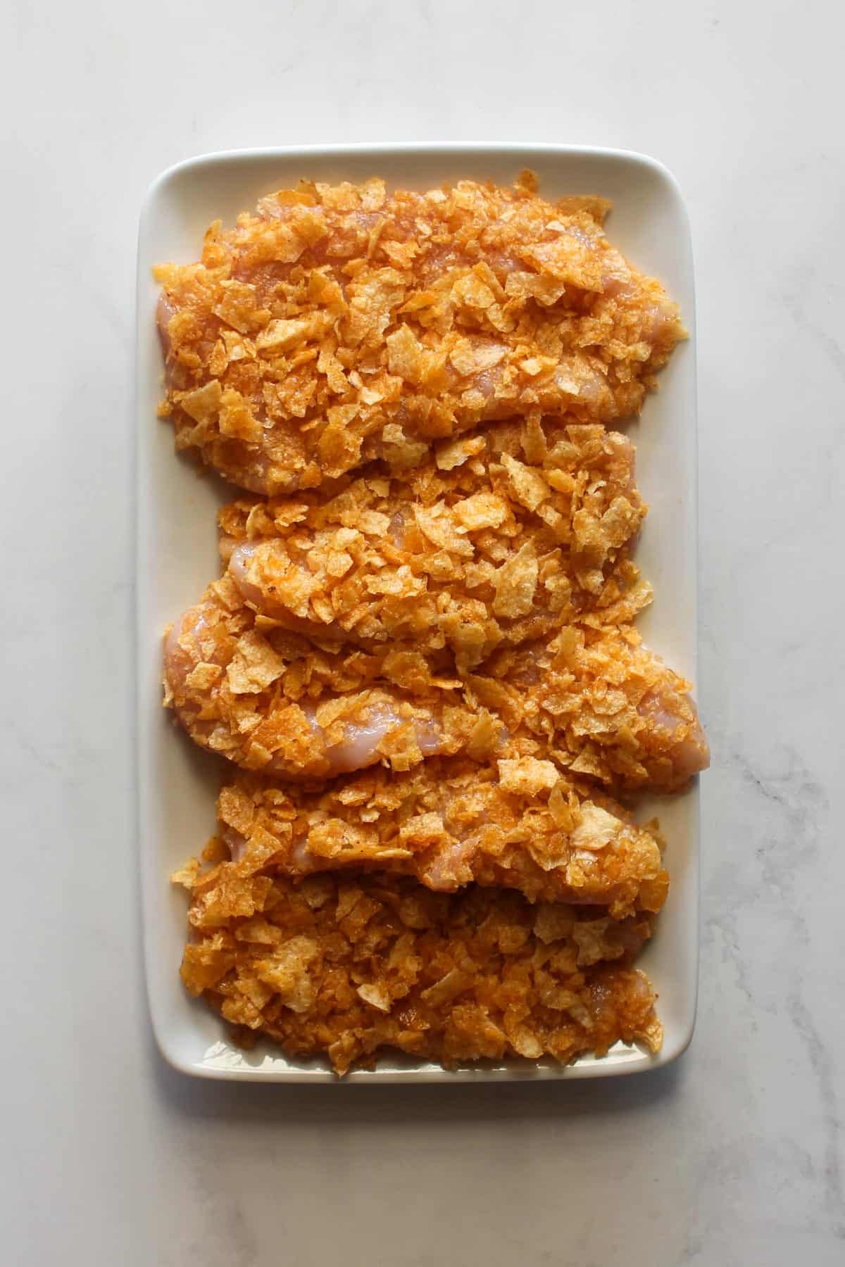 Potato chip coated chicken uncooked