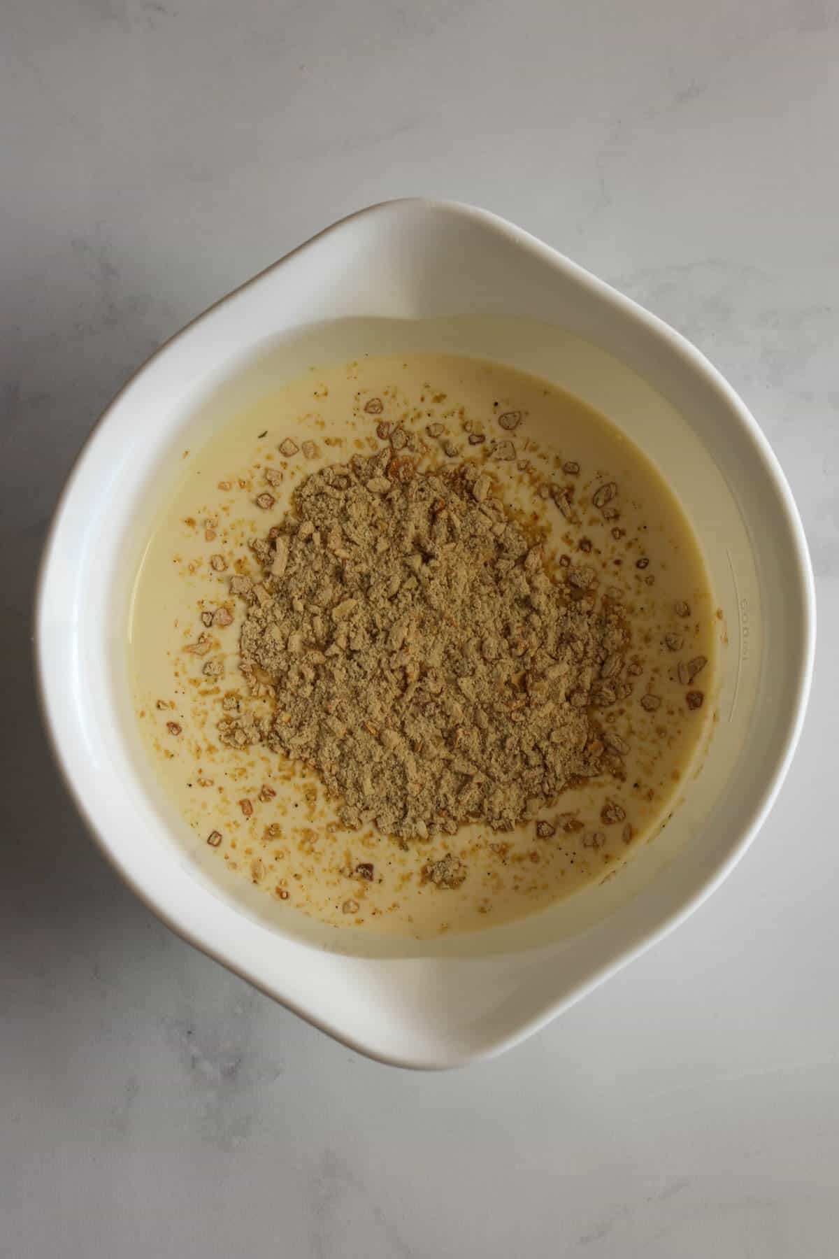 Cream and french onion soup in a white bowl