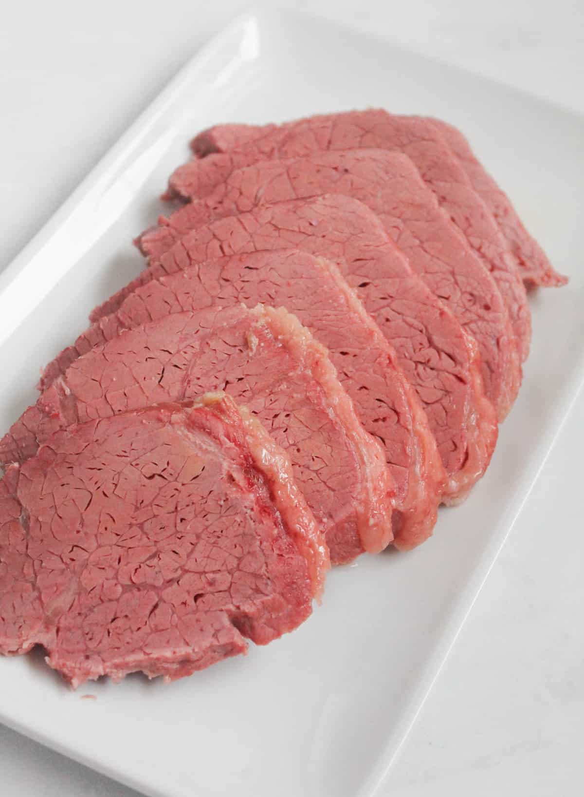 Sliced silverside on a white plate
