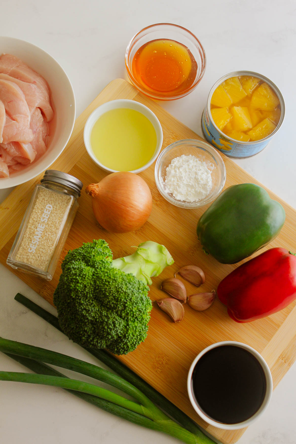 Ingredients for stir-fry on a wooden chopping board