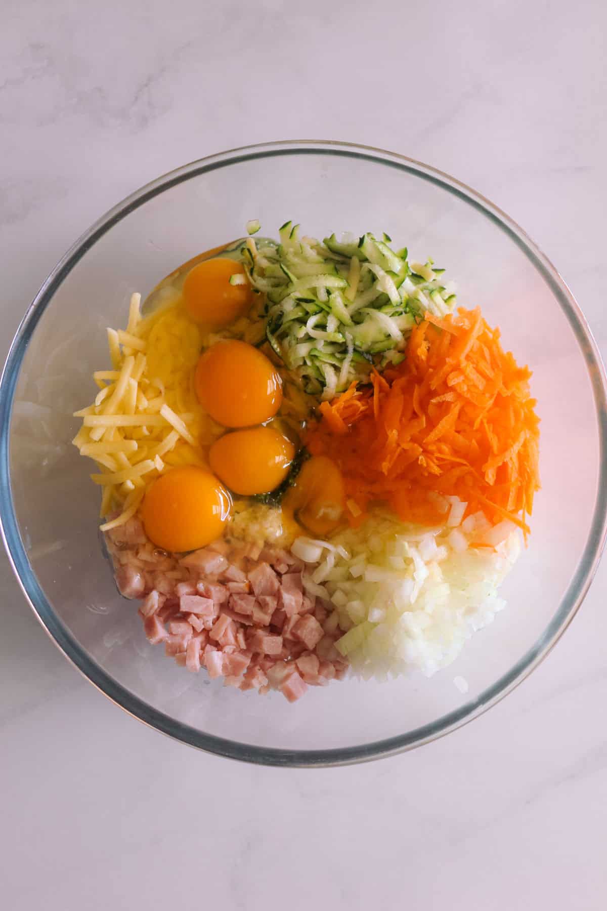 Quiche ingredients prepped and in a glass bowl