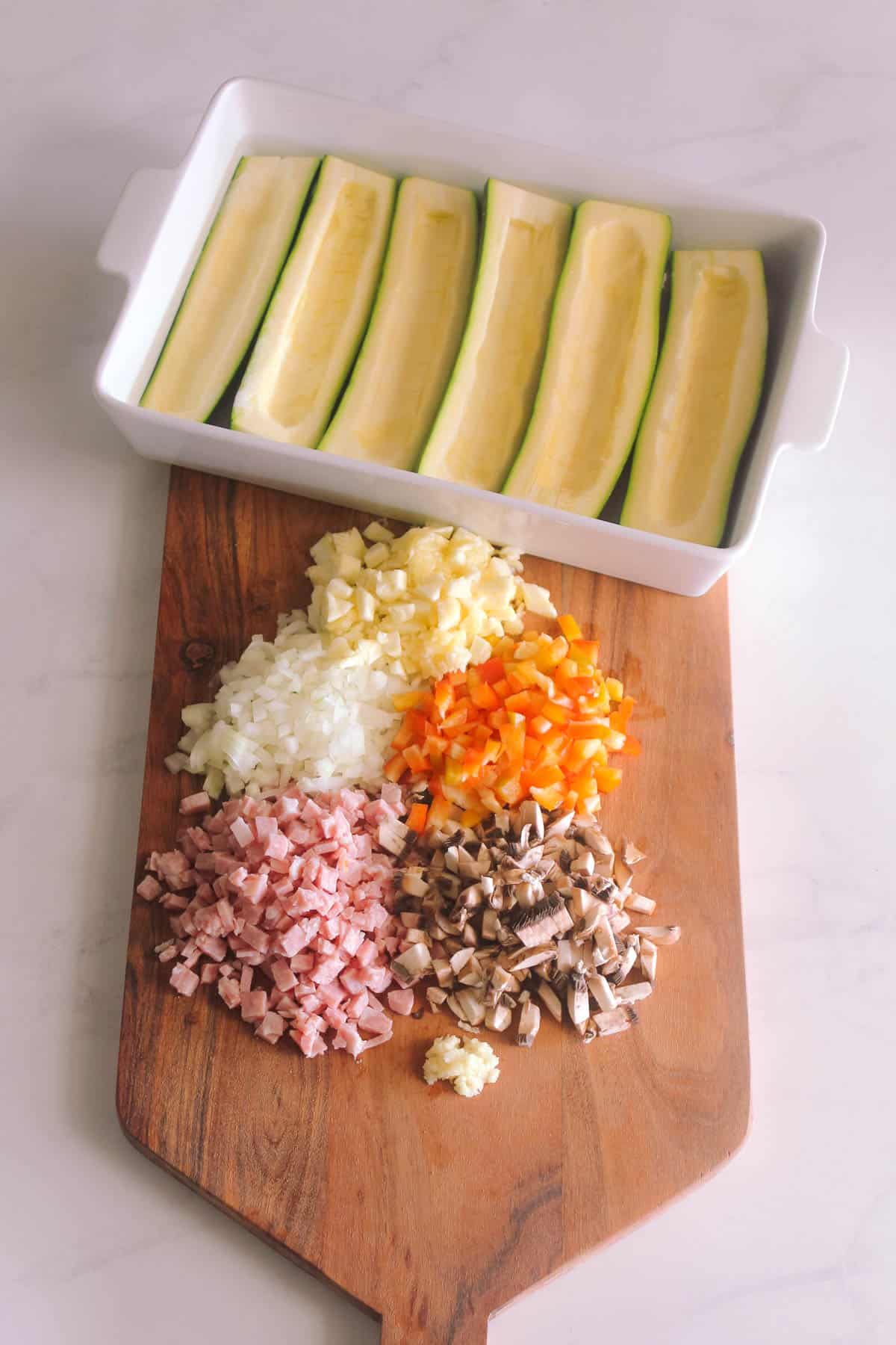Diced zucchini boat ingredients and prepared zucchini